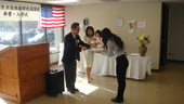 Presentation of a diploma from Mr. Takeda, Principle of the Colorado Japanese School.